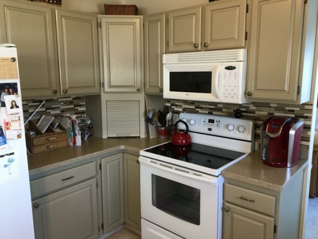 Photo of: Kitchen cabinet refinishing: custom painting project for traditional style kitchen.