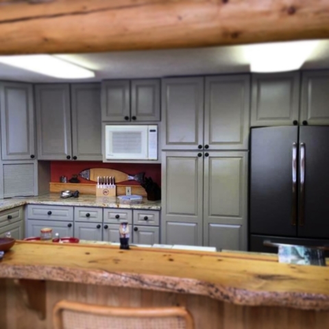 Photo of Kitchen cabinet refinishing: custom painting project.