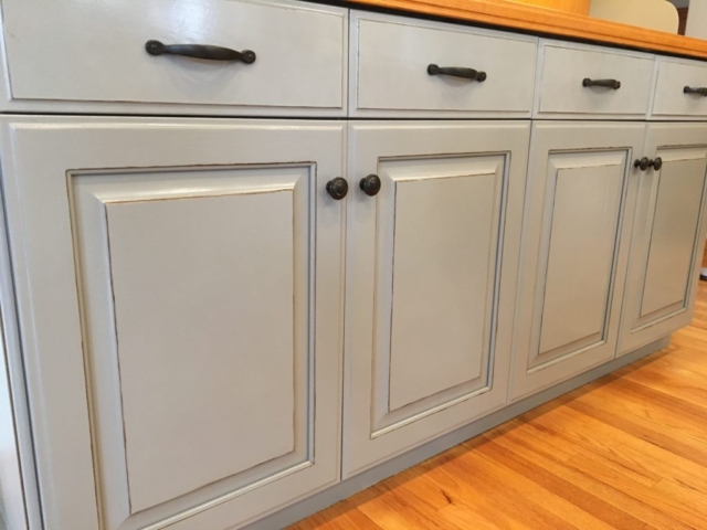 Photo of Kitchen cabinet refinishing: custom painting project.